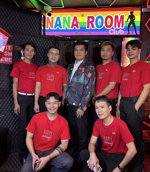 The Banana Room Club team in matching red shirts at the venue entrance